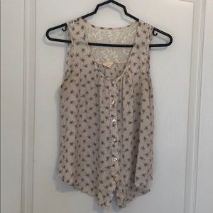 White sleeveless blouse with pattern and lace back